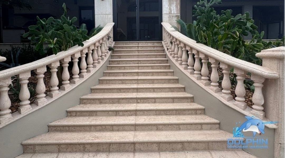 Before and after of stone front steps and balustrade pressure washed, after