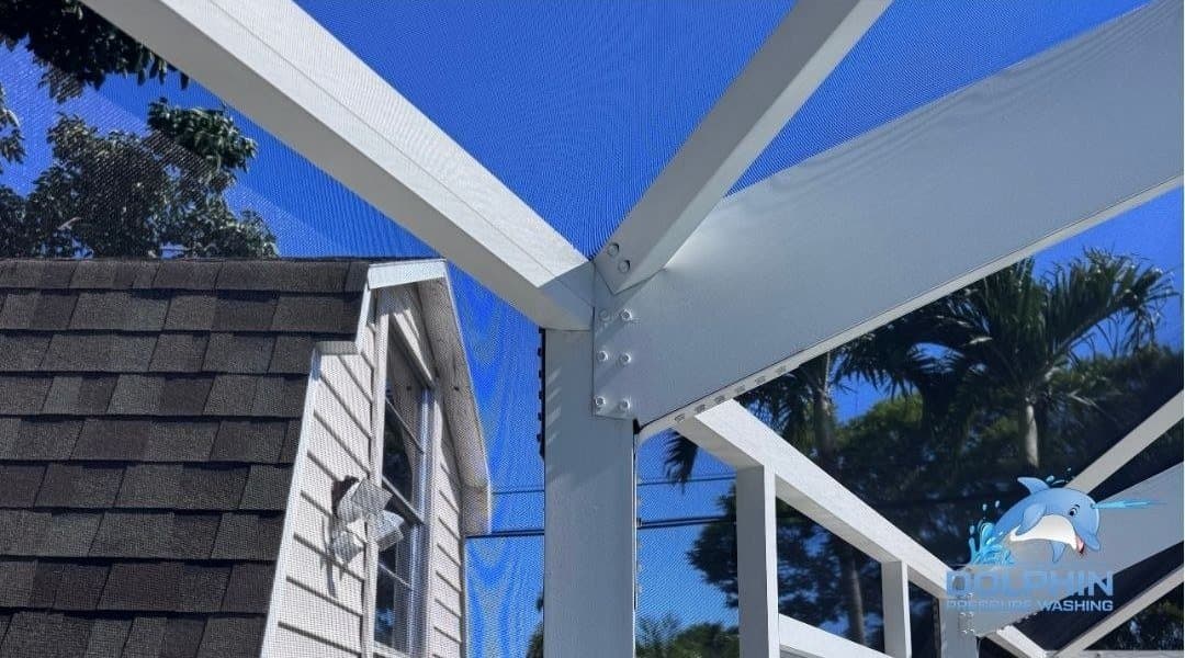 Before and after of a pool cage frame soft washed in Naples, after