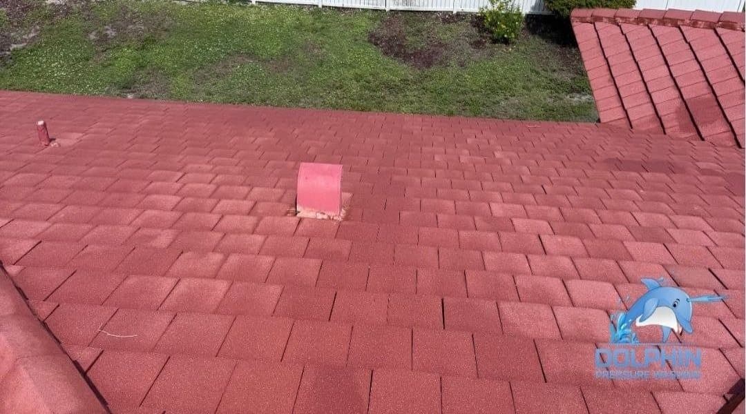 Before and after of a red tile roof ridge washed in Naples, after