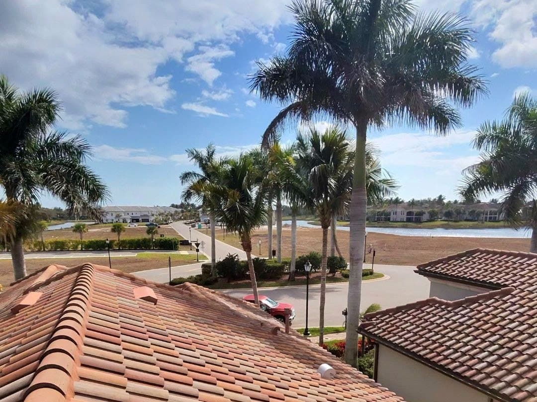 Barrel tile roof washed clean above a Naples lake community