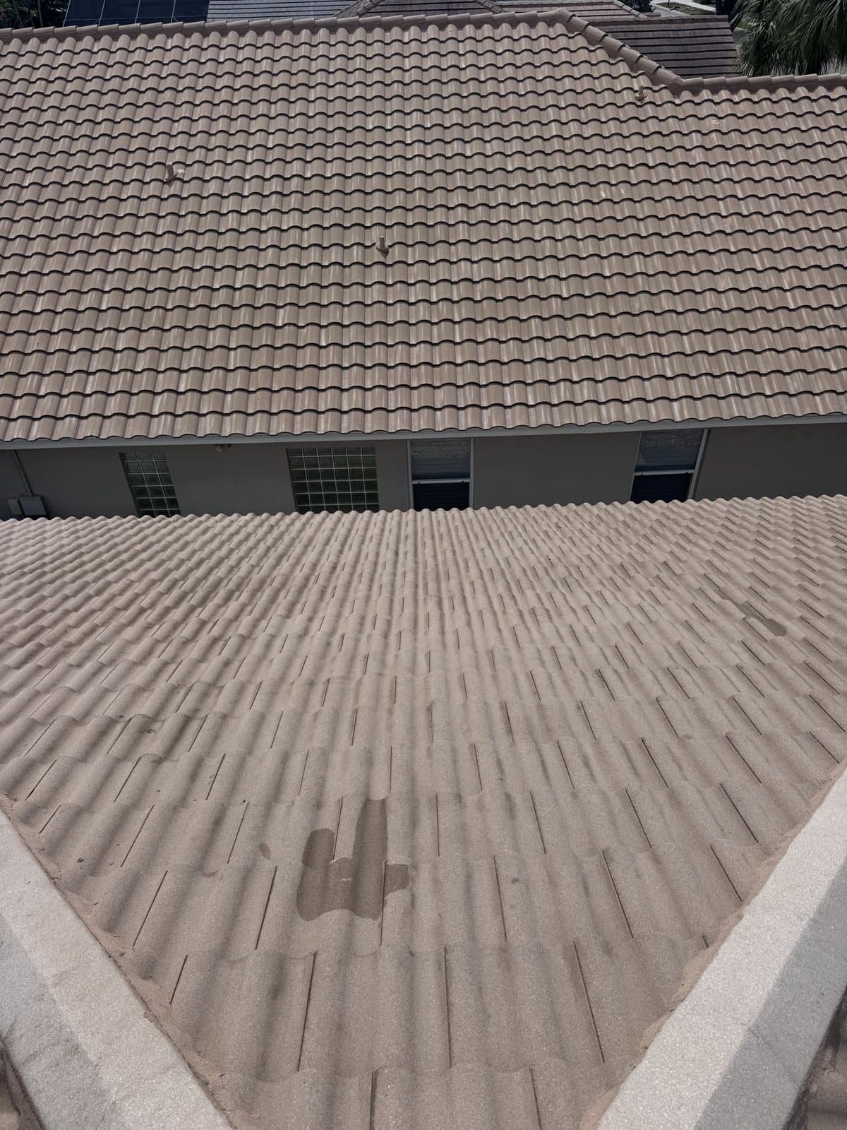 Flat tile roof in Naples after a soft wash, algae gone